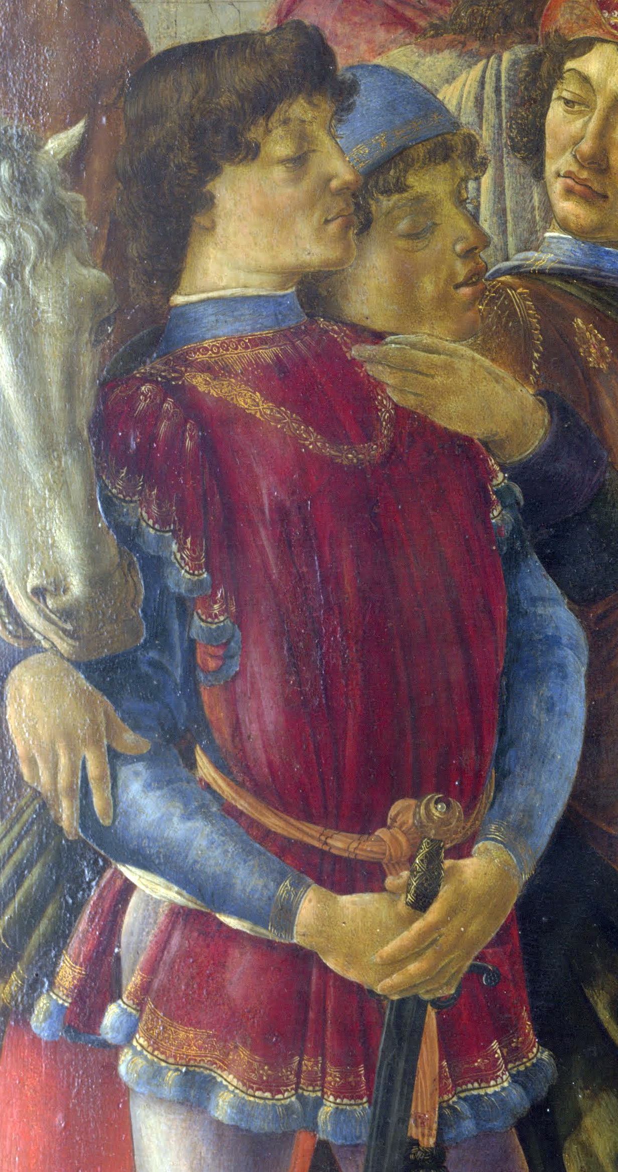 Detail of the standing crowd on the left of the painting: Lorenzo il Magnifico in dark robes, leaning on his sword, with his slightly hawkish profile and the pale, severe expression he wore in most contemporary portraits.