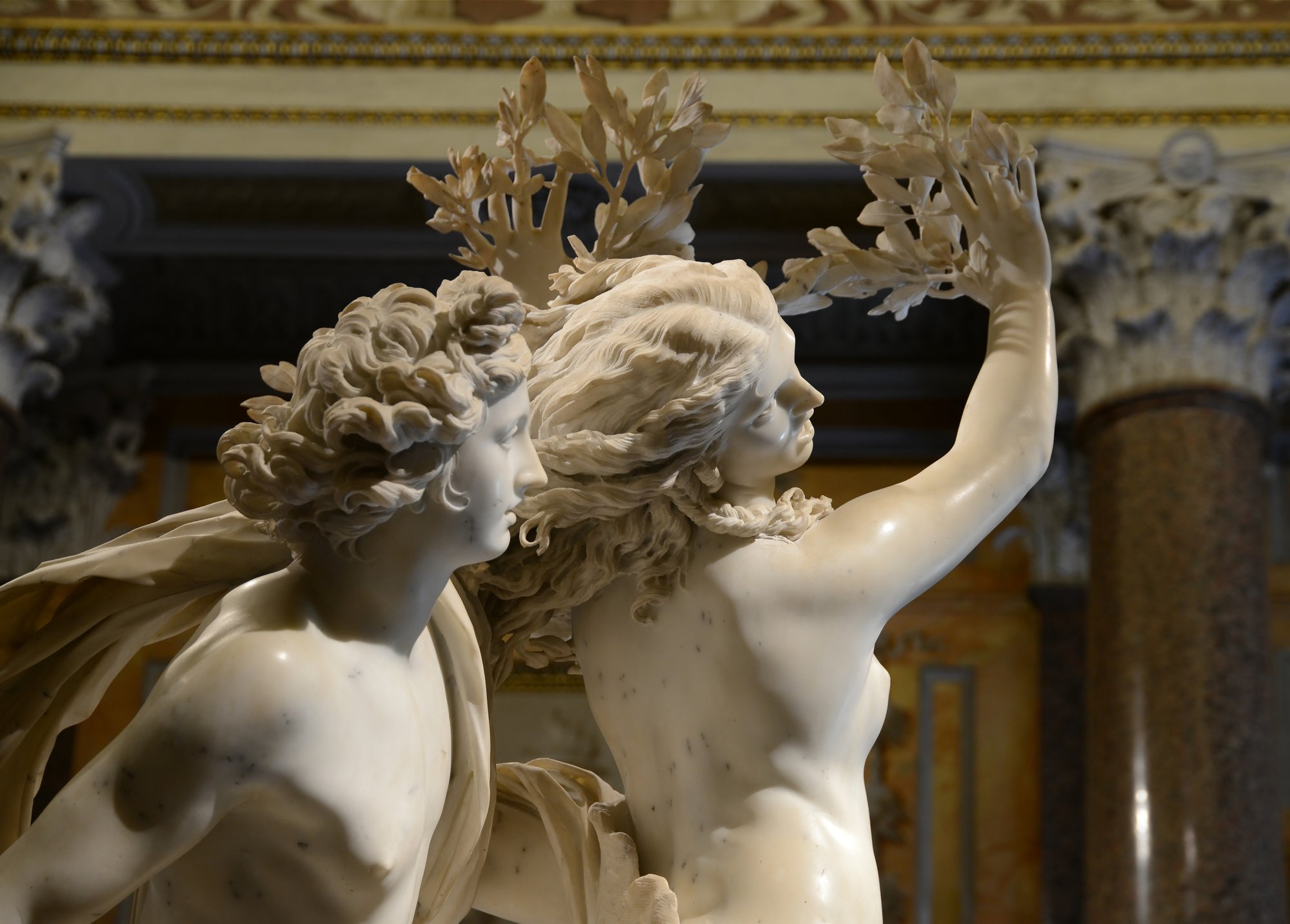 Gian Lorenzo Bernini's Apollo and Daphne, marble sculpture in the Galleria Borghese, Rome, showing Daphne transforming into a laurel tree as Apollo reaches her