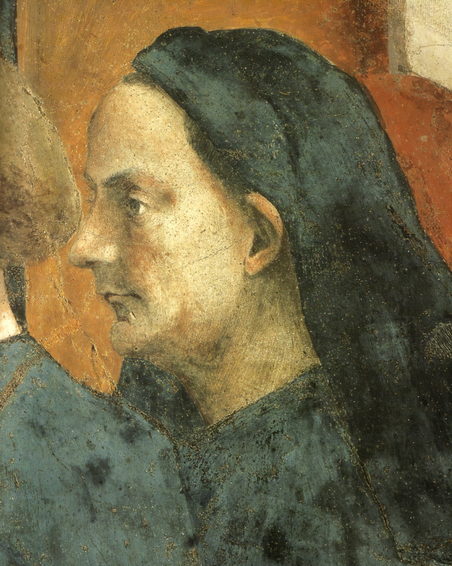 A detail of Masaccio's fresco in the Brancacci Chapel showing the bald, bearded portrait head of Filippo Brunelleschi inserted into a sacred scene.