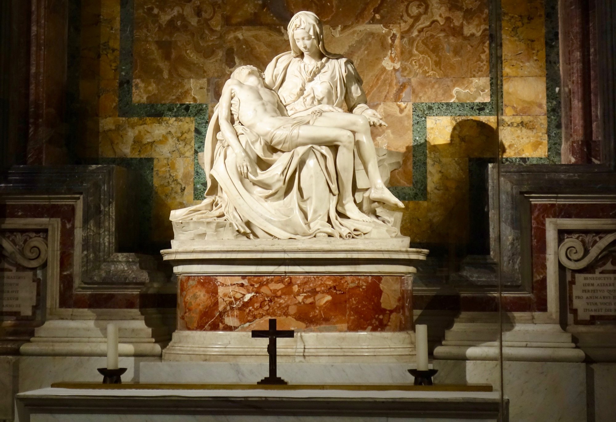 Michelangelo's Pietà viewed from the front, with the diagonal sash running across the Virgin's chest where the sculptor carved his only signature.