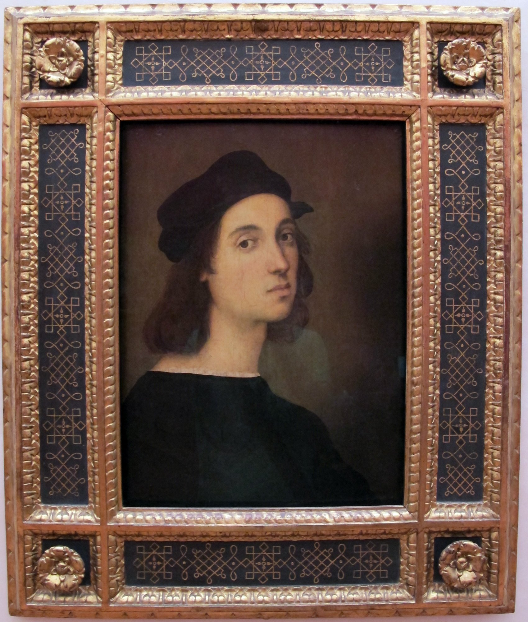 Raphael's Uffizi self-portrait at about twenty-three, showing the same soft features he painted into The School of Athens a few years later.
