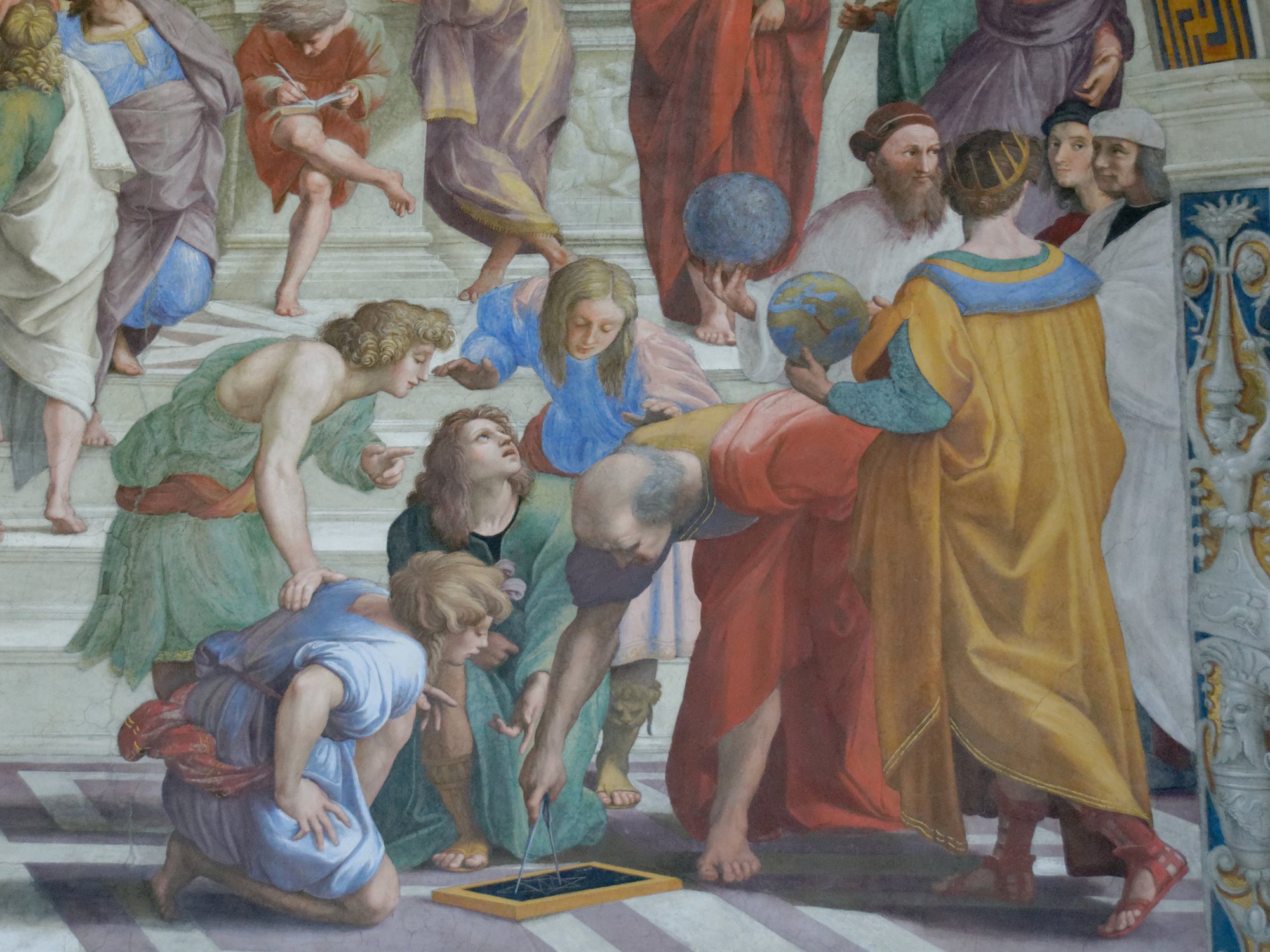 Detail from The School of Athens showing Euclid bent over a slate with a compass surrounded by students, with Zoroaster and Ptolemy holding celestial and terrestrial globes to the right.