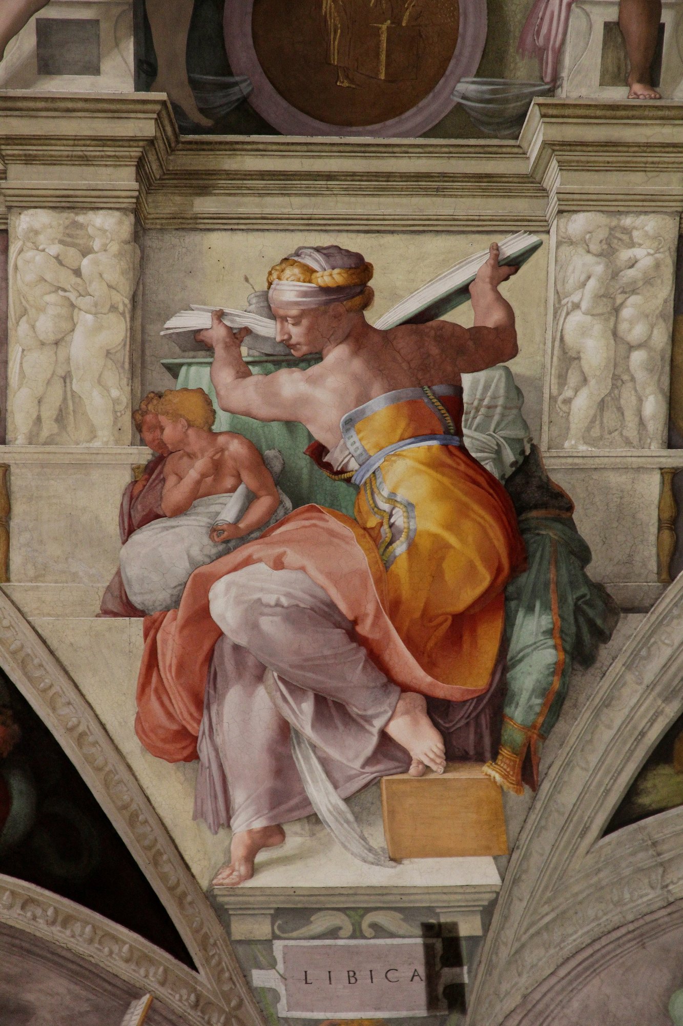 Libyan Sibyl area after restoration, showing the coral pink and lime green palette that emerged when centuries of glue and soot were cleaned off