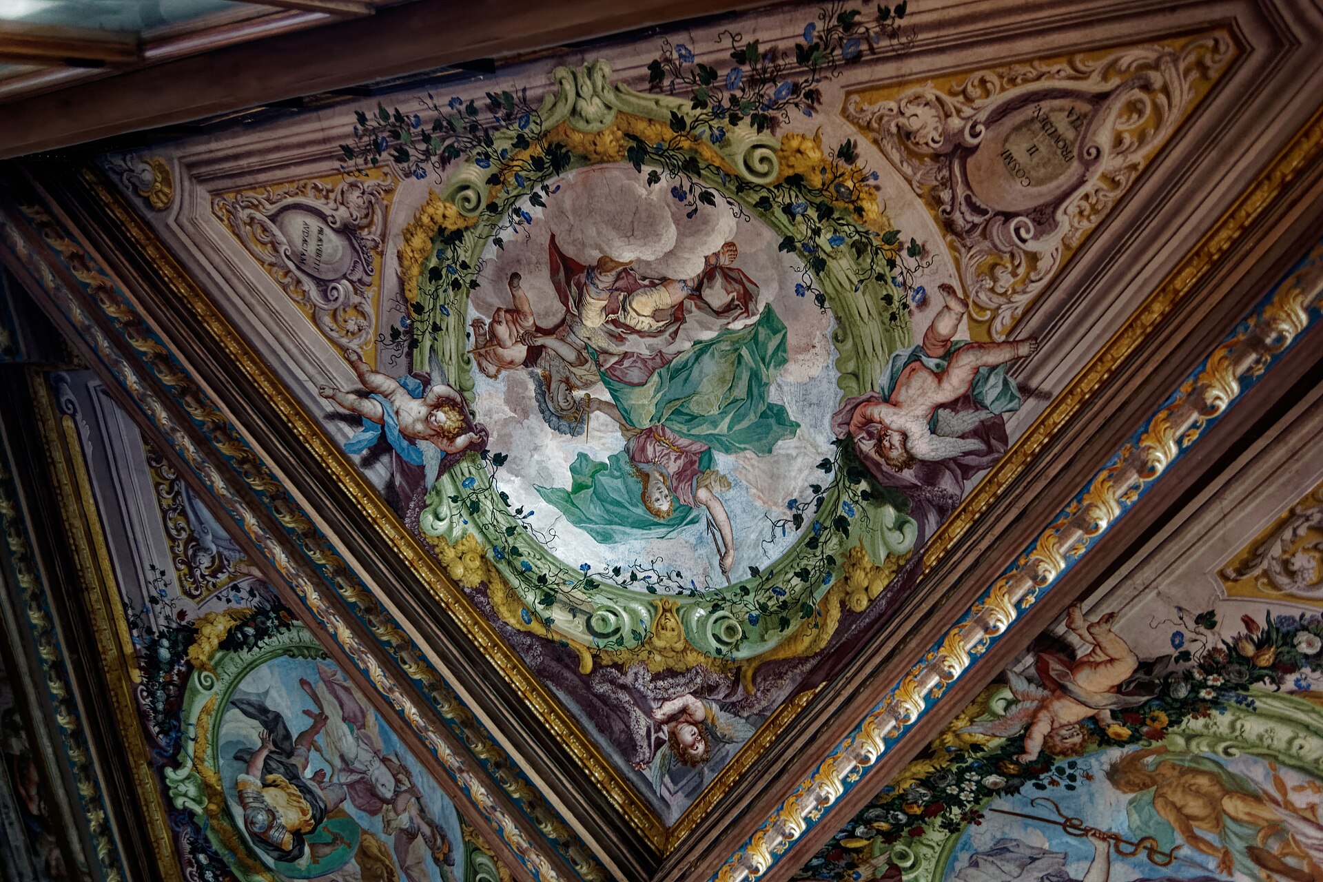 The decorated ceiling of the East Corridor, with sixteenth-century grotesques copied from the Roman wall paintings of Nero's Golden House, running for the full length of the wing above the rows of classical sculptures.