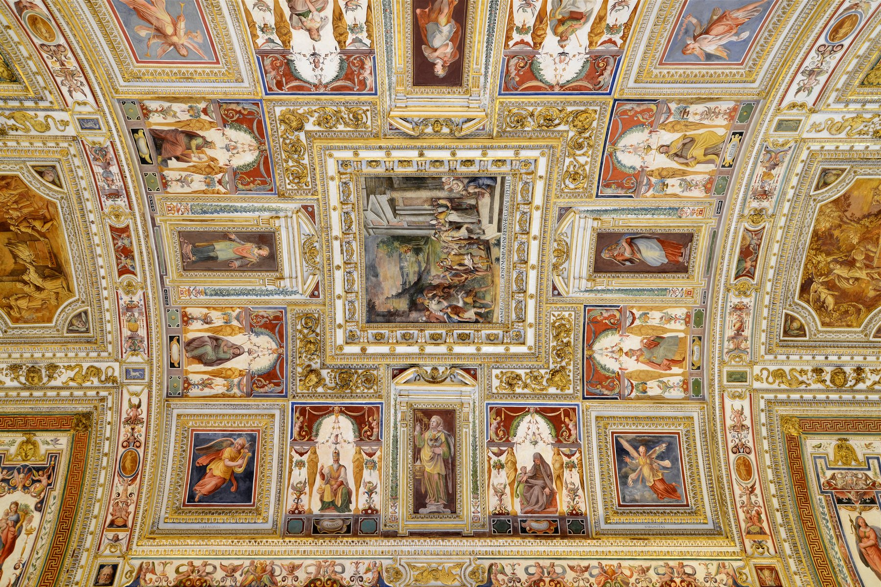 The Gallery of Maps in the Vatican Museums, a one-hundred-twenty-meter corridor lined with sixteenth-century fresco maps of the Italian regions on the walls and a gilded ceiling above.