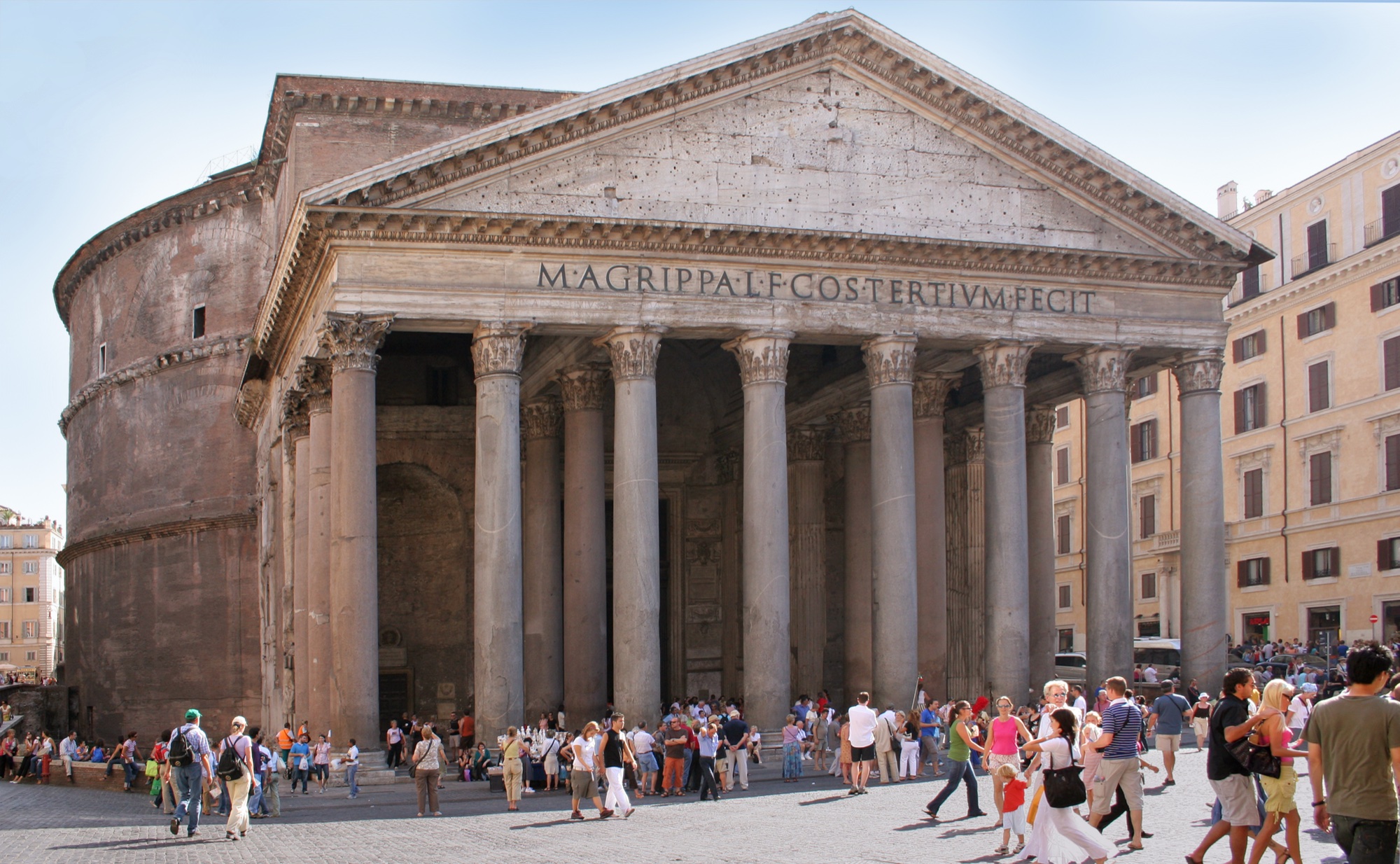 The front of the Pantheon in Rome, with the sixteen Egyptian granite columns of the porch and the bronze inscription M AGRIPPA L F COS TERTIUM FECIT across the pediment.